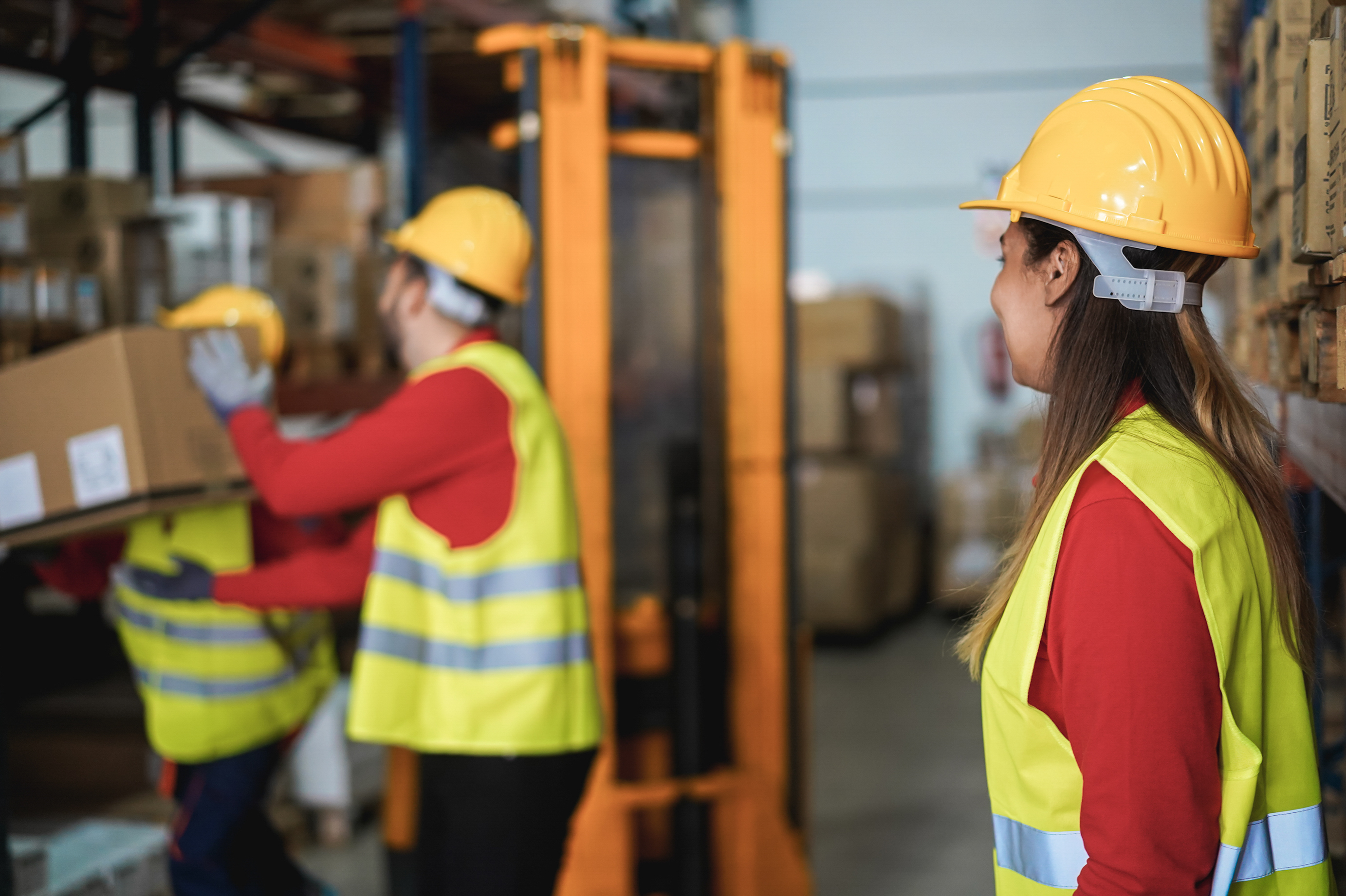 2025-05_industrial-workers-loading-delivery-boxes-1937434138.jpg
