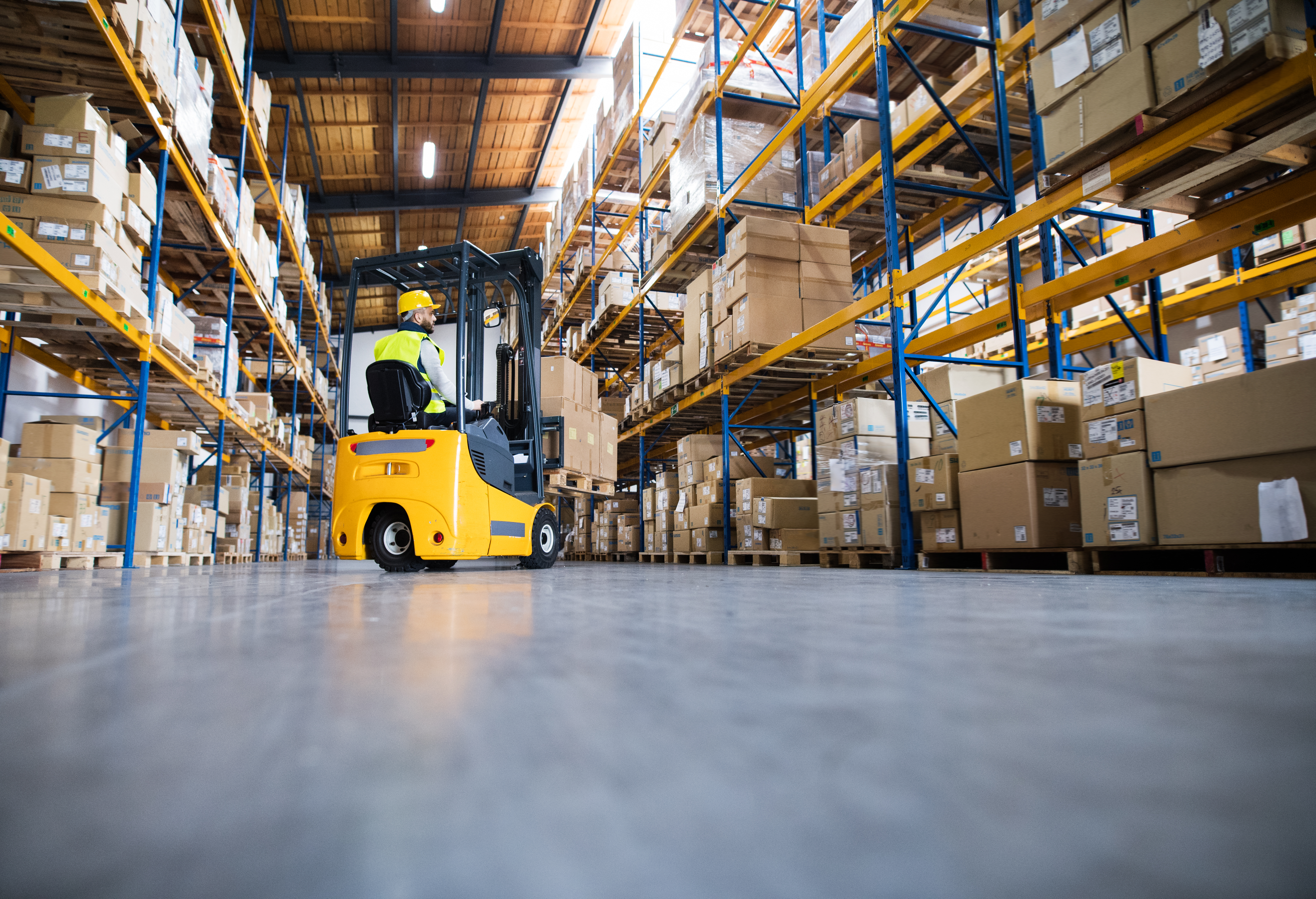 2025-05_warehouse-man-worker-forklift-776936068.jpg
