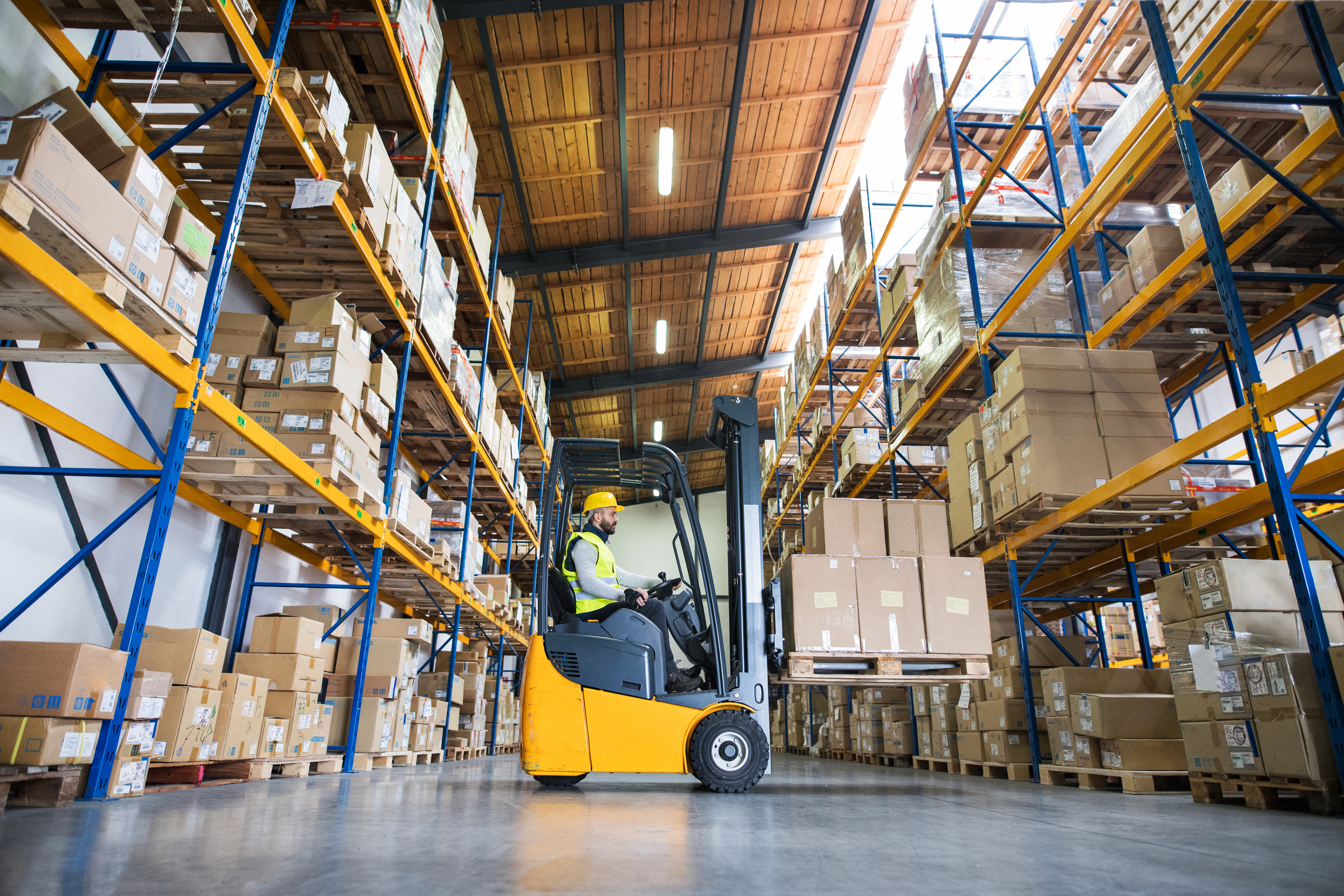 2025-05_warehouse-man-worker-forklift-794138326.jpg
