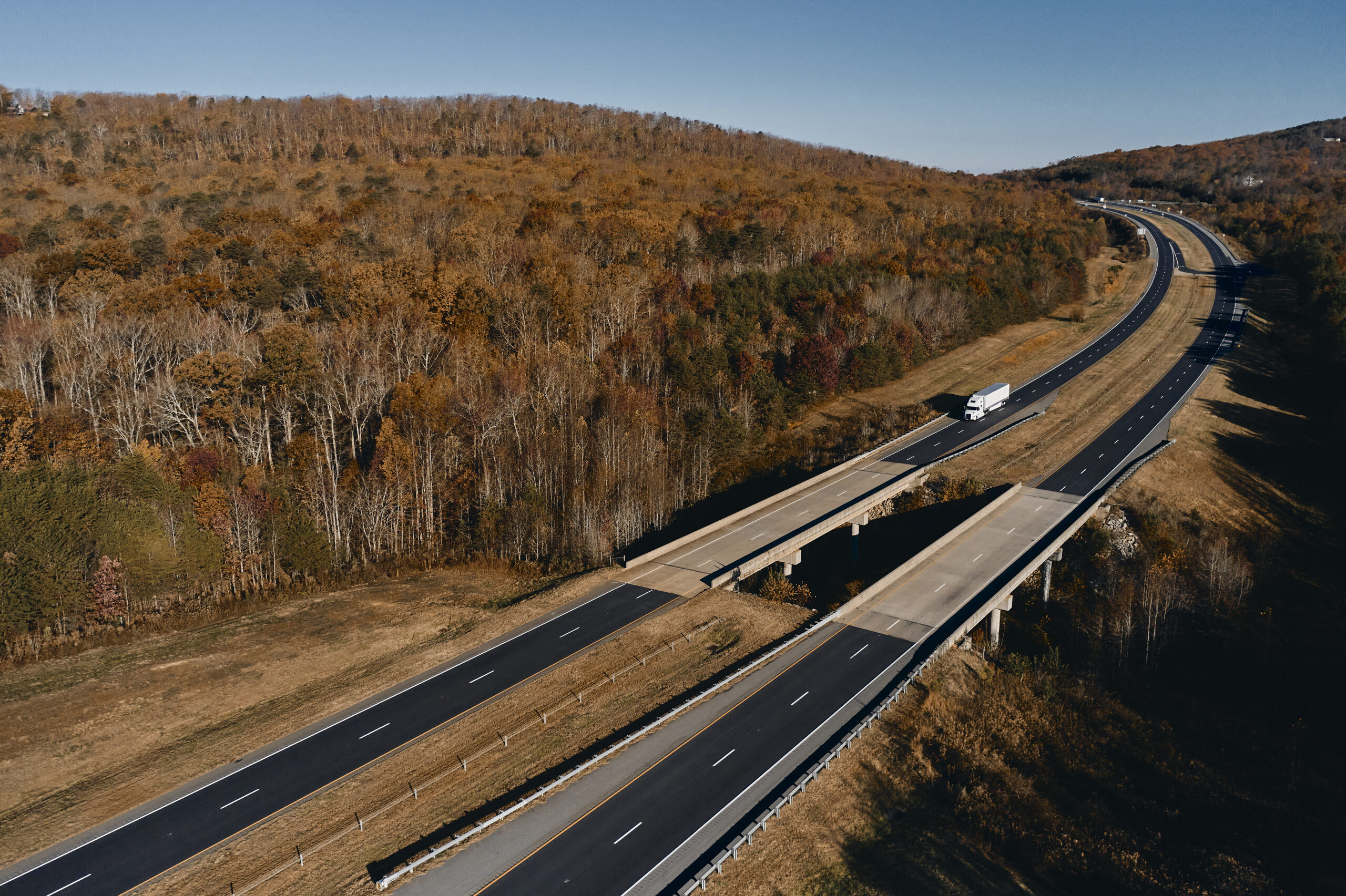Navigate Market Volatility: Unlock the Full Trucking Asset Brokerage Hybrid Model Benefits